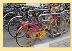 Image of a wildly colored bike among gray ones